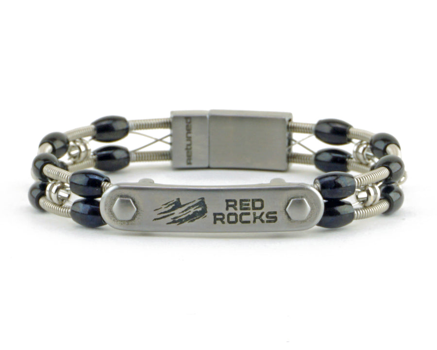 Take your merch to the next level with custom bracelets hand made from repurposed, used guitar strings by Retuned Jewelry in Colorado. Perfect for bands, musicians, music festivals, fundraisers and more! This sample was made for Red Rocks Amphitheater.